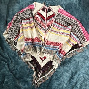 Anthropologie Multicolor Fringe Knit Poncho in Cream, Red, Blue, Yellow